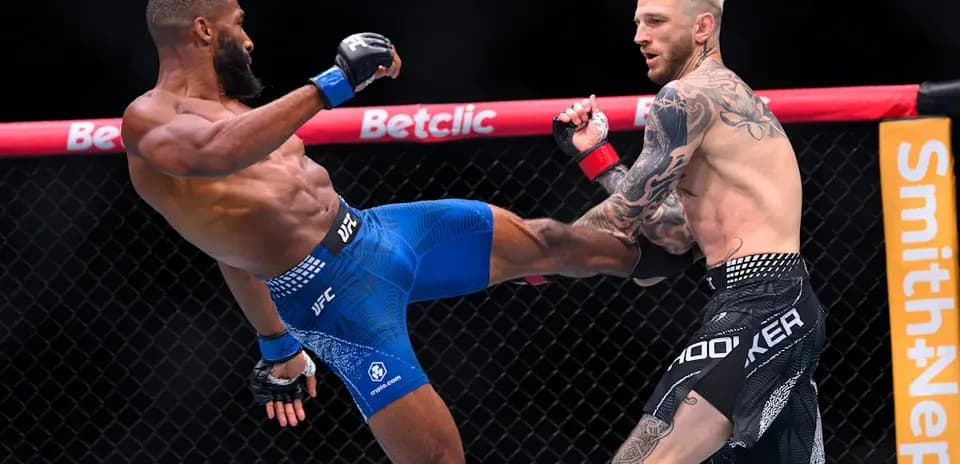Two fighters exchanging kicks in UFC match