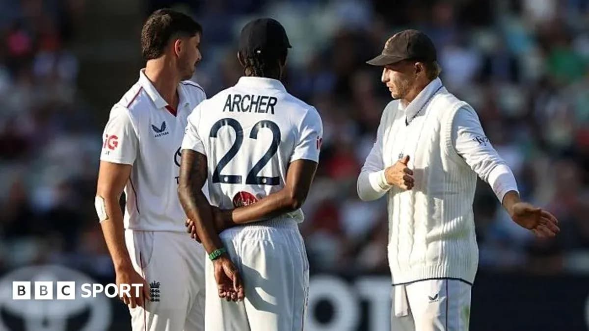 Cricket players discussing strategy on the field