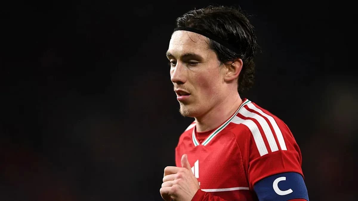Player wearing red jersey with captain's armband