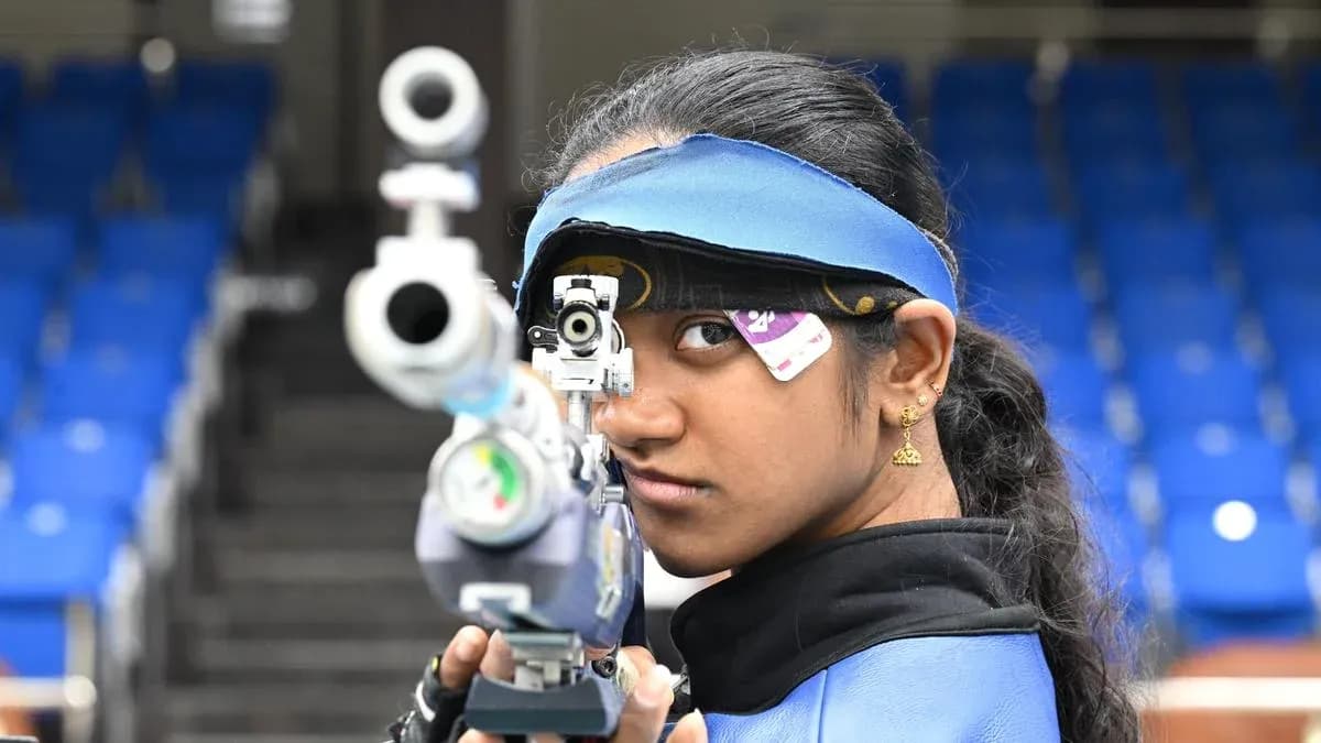 Shooter aiming with rifle at shooting range