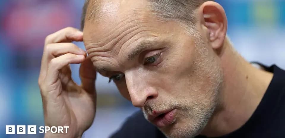 Manager speaking at press conference with thoughtful expression