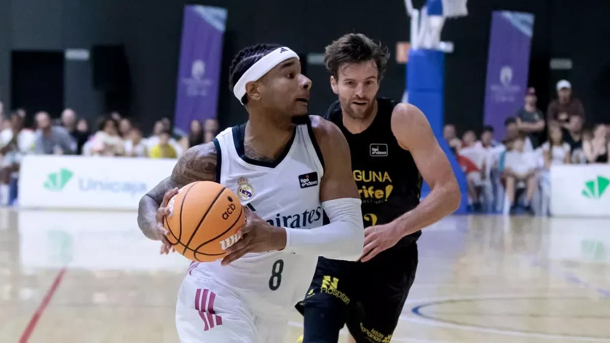 Player dribbling basketball while being closely guarded