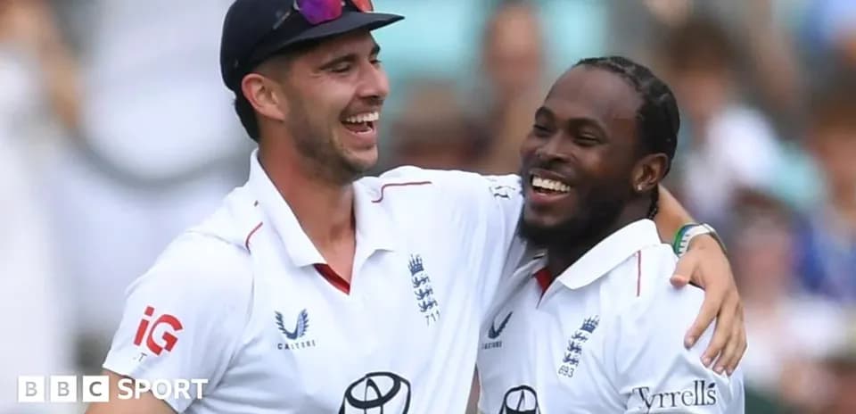 Two England cricket players celebrating on the field
