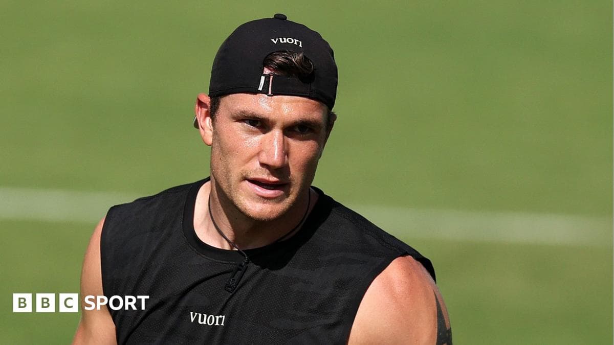 Athlete training on the field in black tank top
