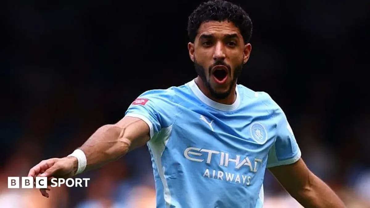 Player celebrating during a match for Manchester City