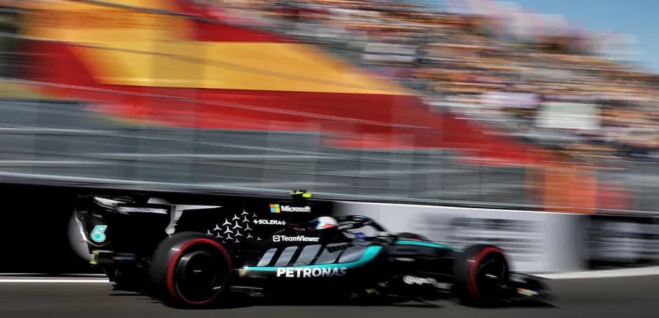 Formula 1 car racing on track at high speed