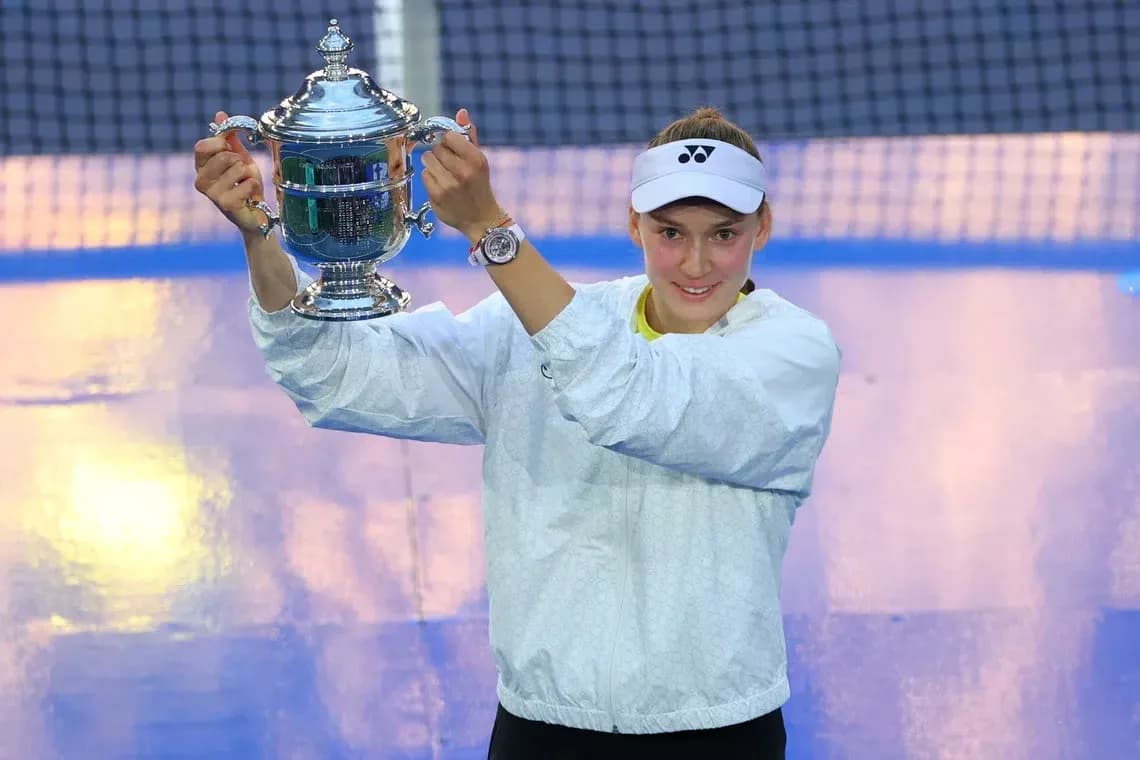Player holding trophy after winning tennis match