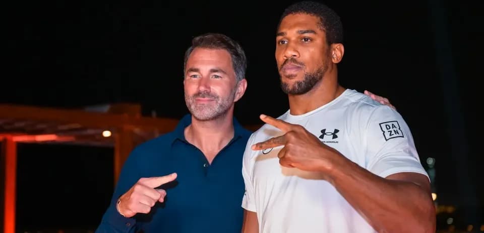 Two men posing together with peace signs