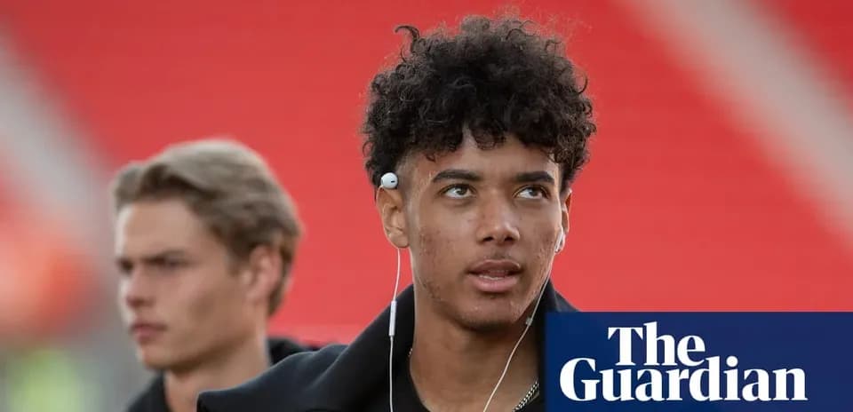 Two young men walking with earbuds before match