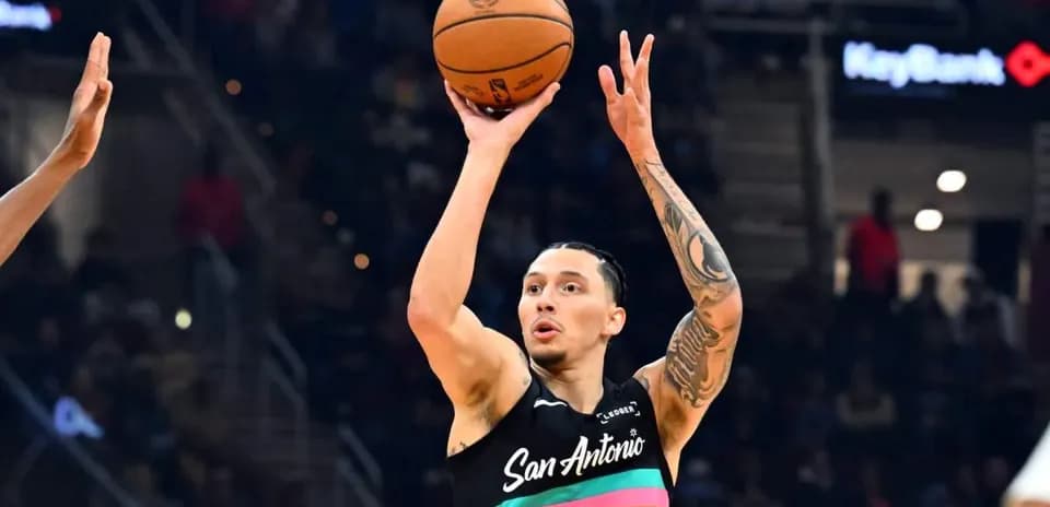 Player shooting a basketball during a game