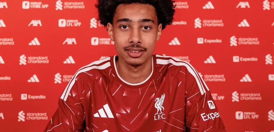 Player signing contract at Liverpool FC press event