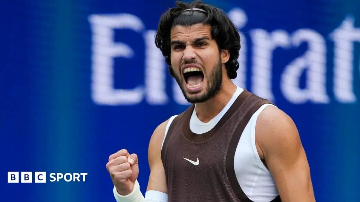 Tennis player celebrating victory with a clenched fist