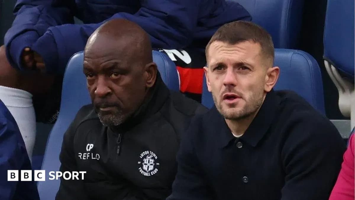 Two men seated on the bench during a match