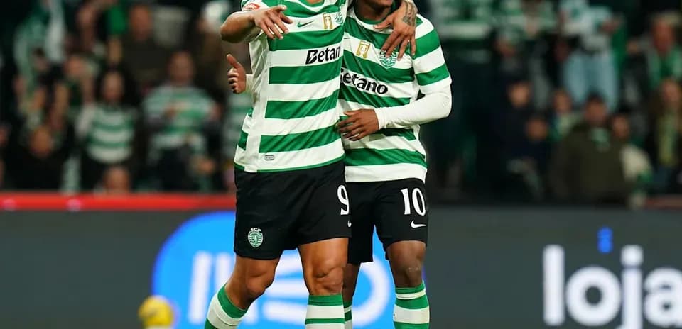 Two players celebrating together on the field