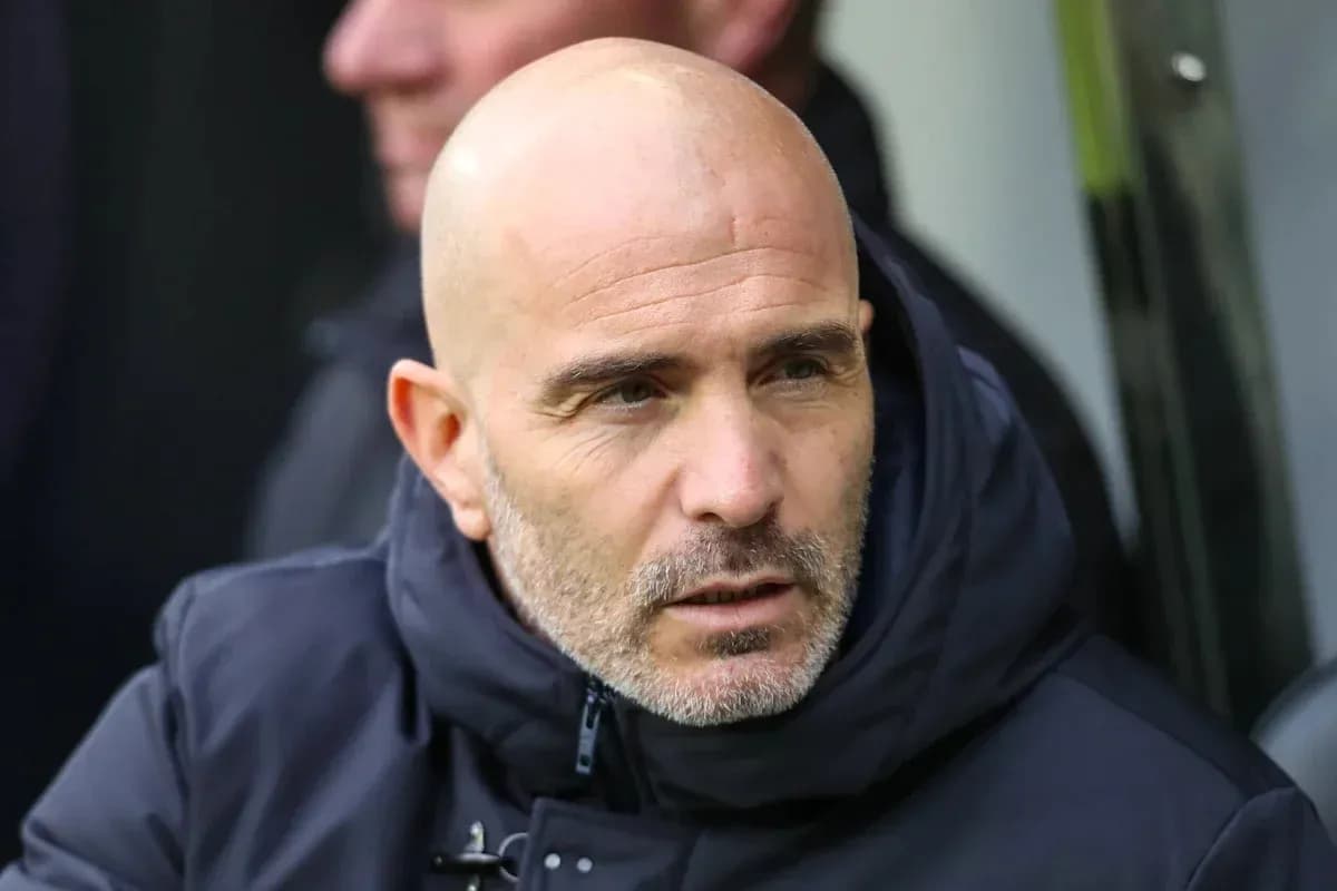Coach sitting on the bench during a match