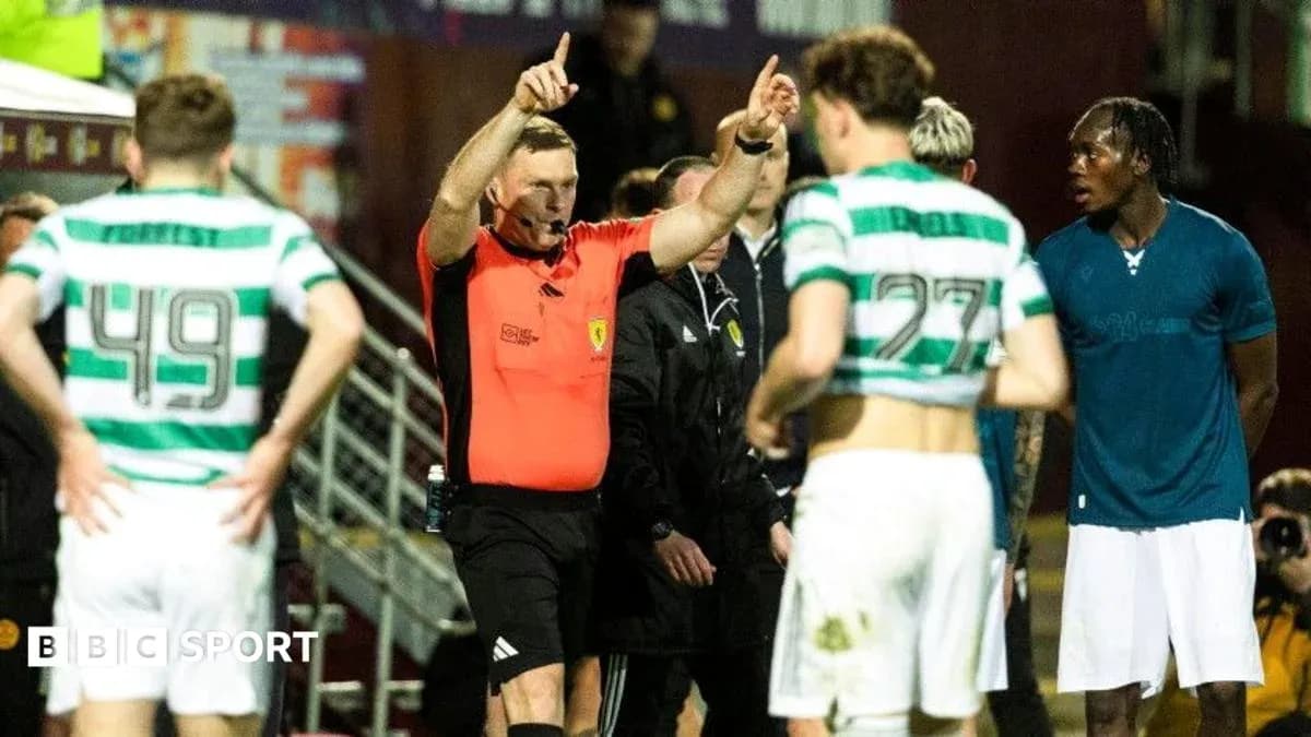 Referee signaling during a tense match situation