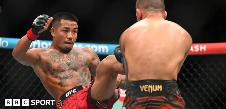 Fighter delivering a kick in UFC match