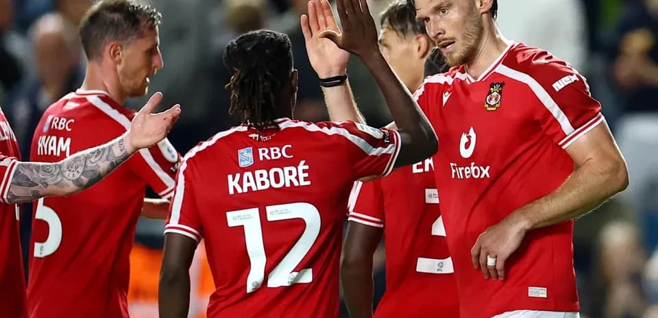 Players celebrating together after a goal