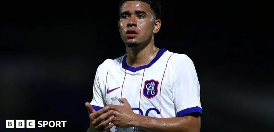 Player in Chelsea FC kit holding water bottle