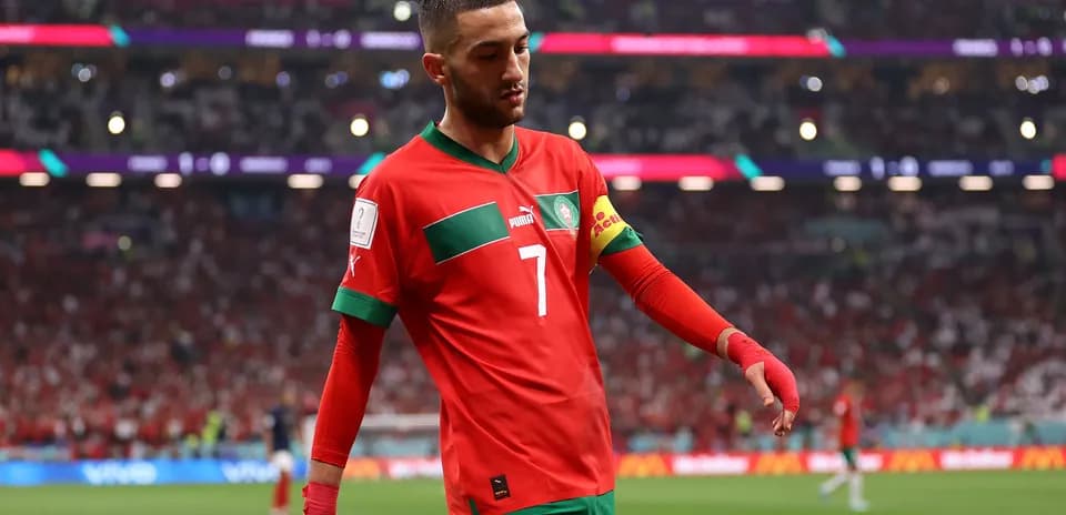 Hakim Ziyech walking on the pitch in Morocco kit