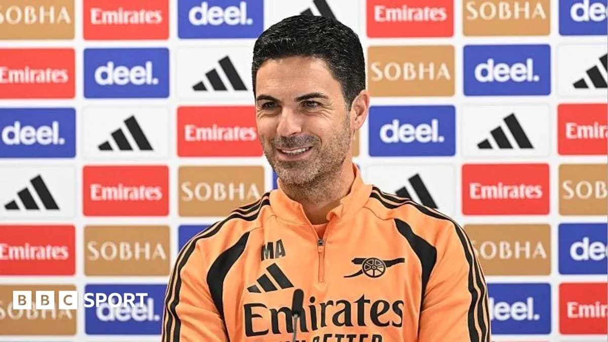 Manager speaking at press conference with sponsor backdrop