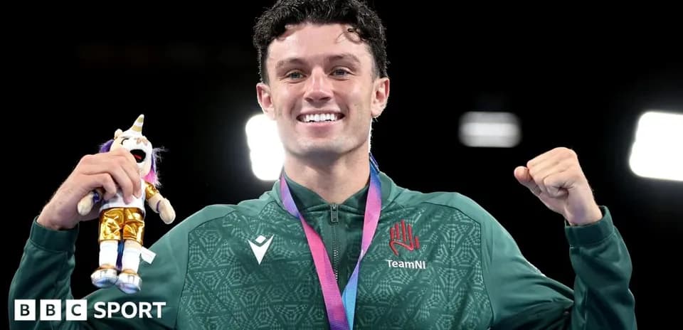 Athlete celebrating with medal and toy unicorn