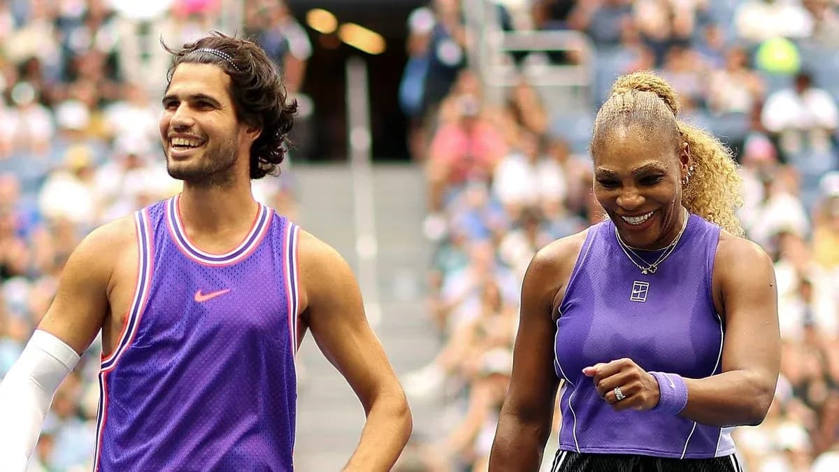 Two tennis players smiling during a match