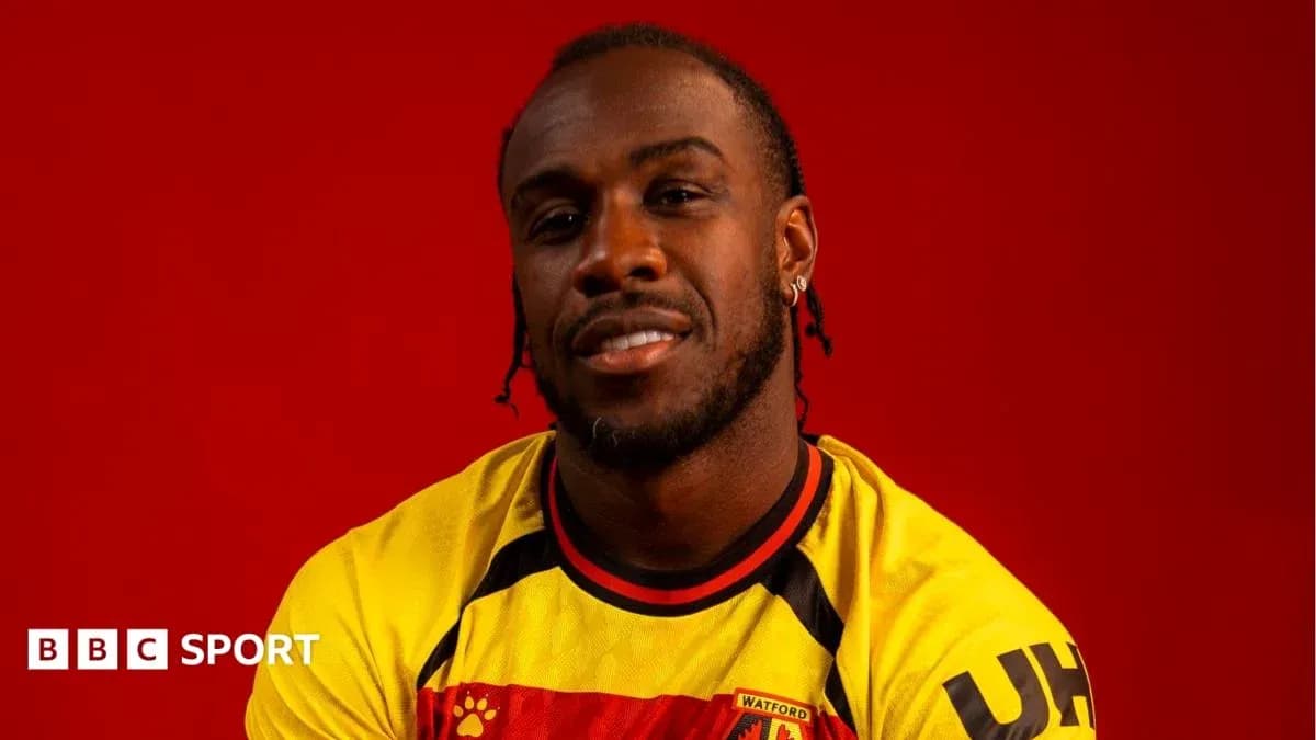 Player in Watford jersey against red background