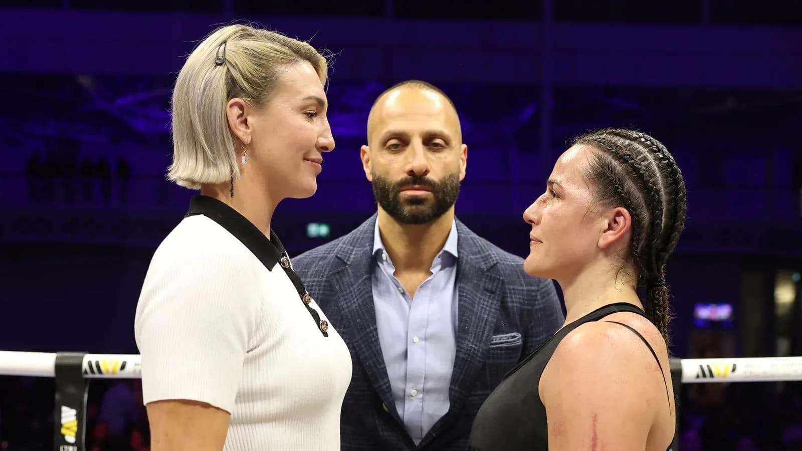 Two fighters facing off before the match