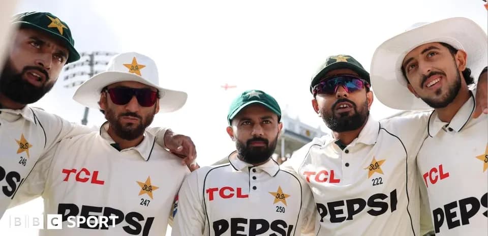 Pakistan cricket players posing together on field