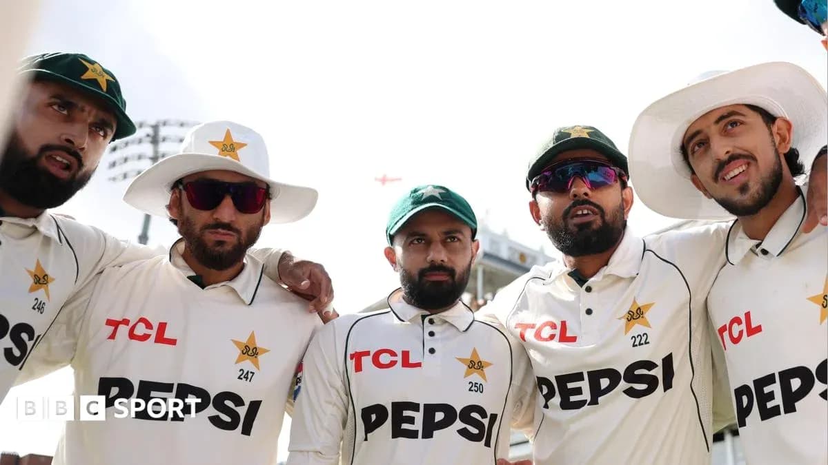 Pakistan cricket players posing together on field
