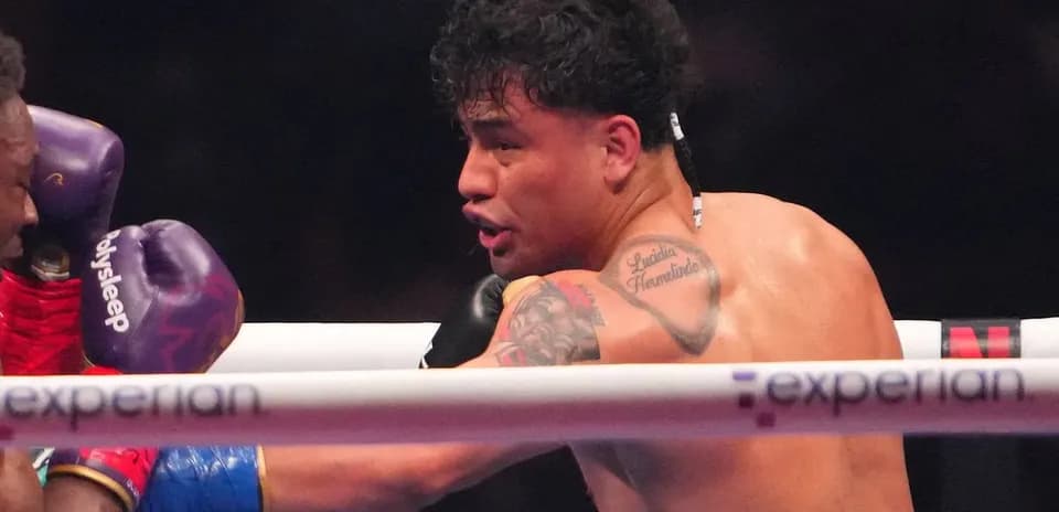 Boxer throwing a punch in the ring
