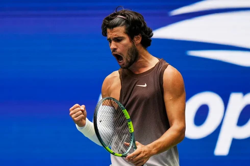 Tennis player celebrating a point on court