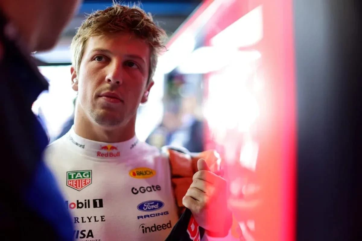 Driver in racing suit preparing for event