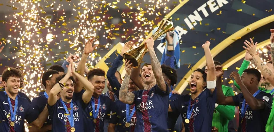 PSG players celebrating with trophy and confetti