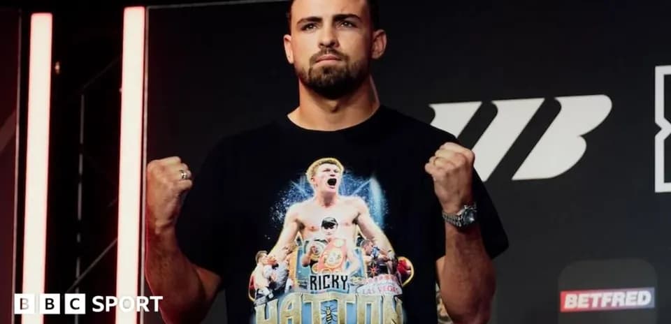 Boxer posing with clenched fists at event