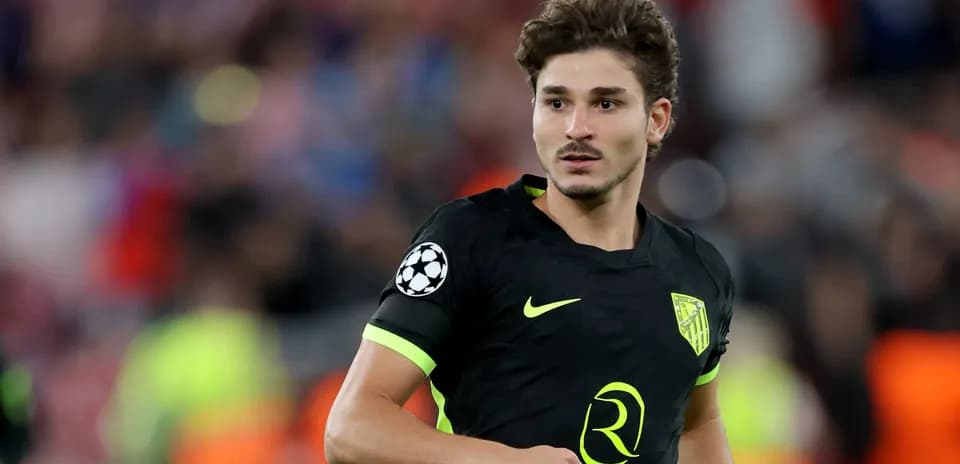 Player in black kit during Champions League match