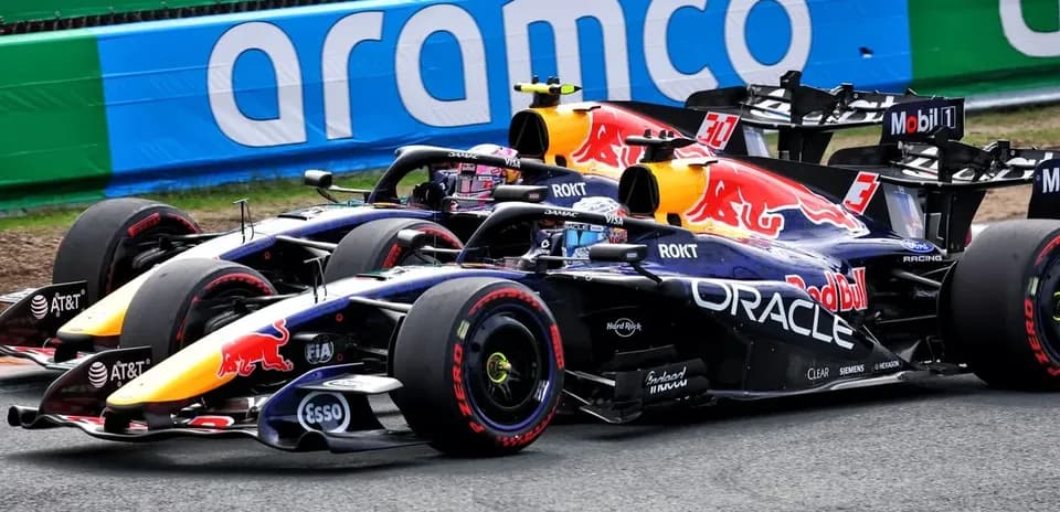 Two Red Bull Racing cars competing on track