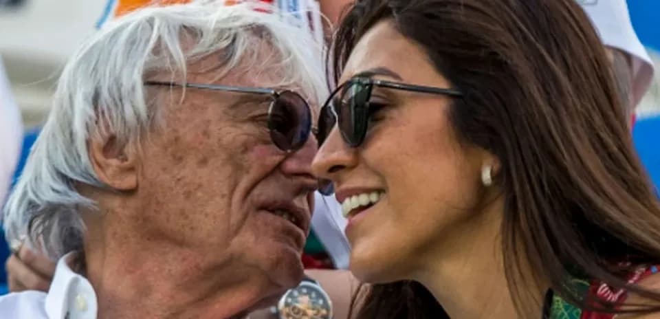 Two people smiling and wearing sunglasses together