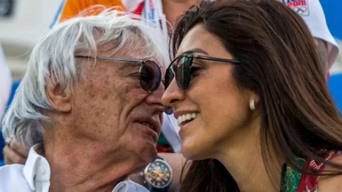 Two people smiling and wearing sunglasses together