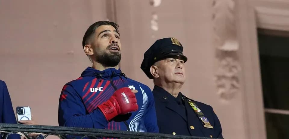 UFC fighter singing national anthem with police officer