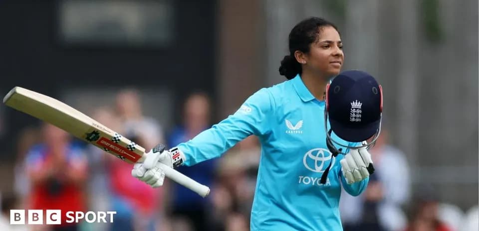 Batter celebrating with helmet and bat during match