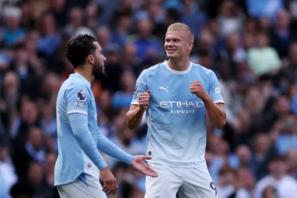 Manchester City players celebrating a goal together