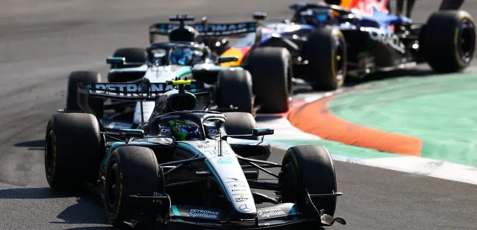 Formula 1 cars racing on track during competition
