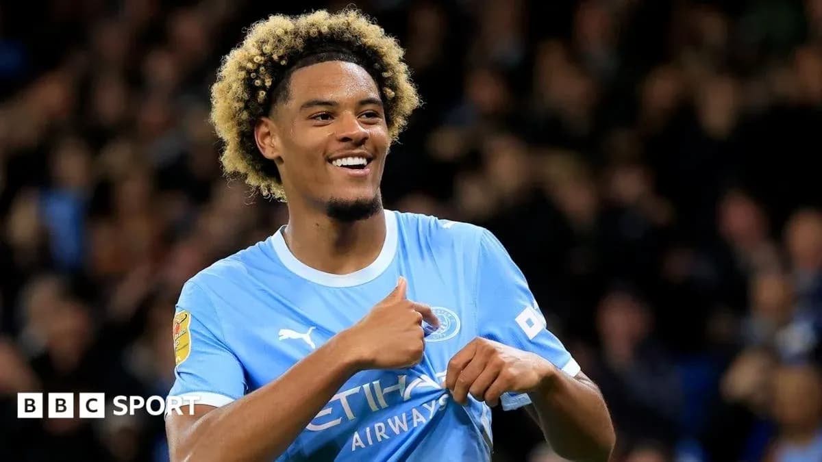 Player celebrating a goal in Manchester City jersey