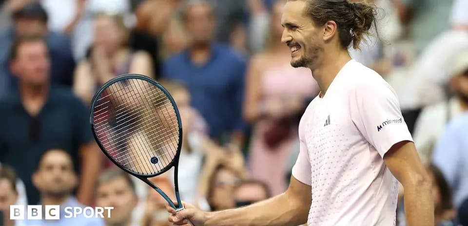 Tennis player celebrating with racket during match