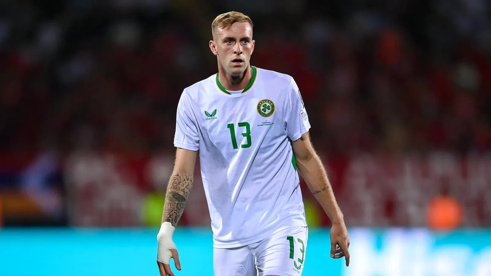 Player wearing white jersey during football match