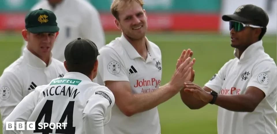 Cricket players celebrating a wicket on field