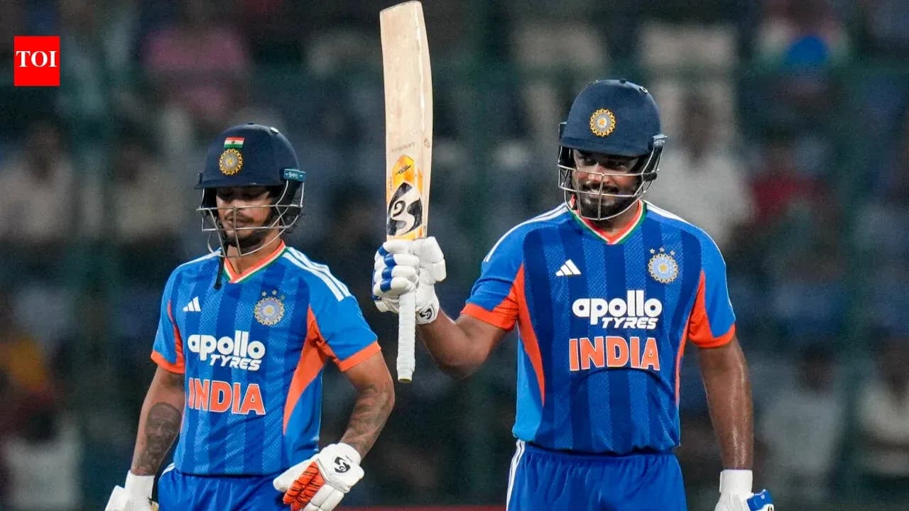 Two Indian cricketers celebrating on the field