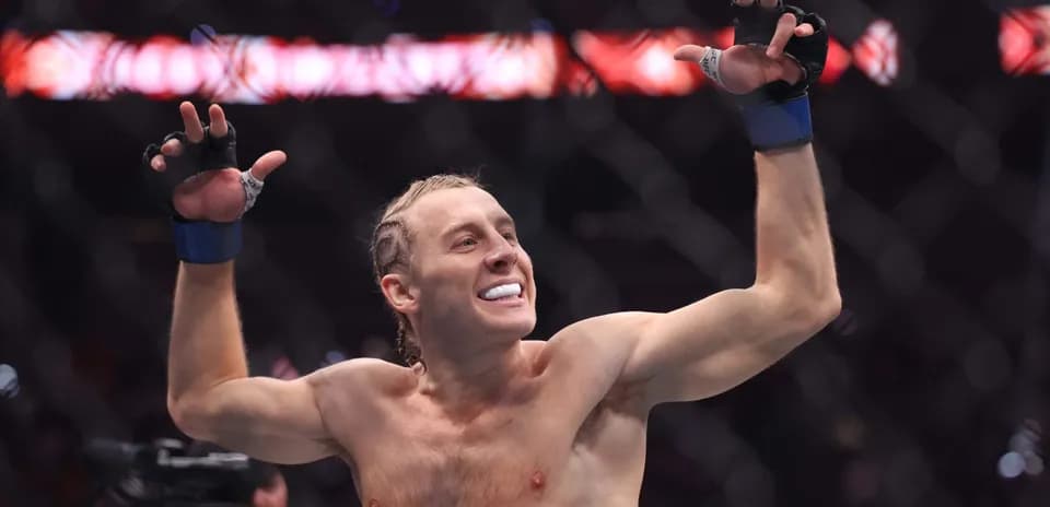 Fighter celebrating victory in the octagon